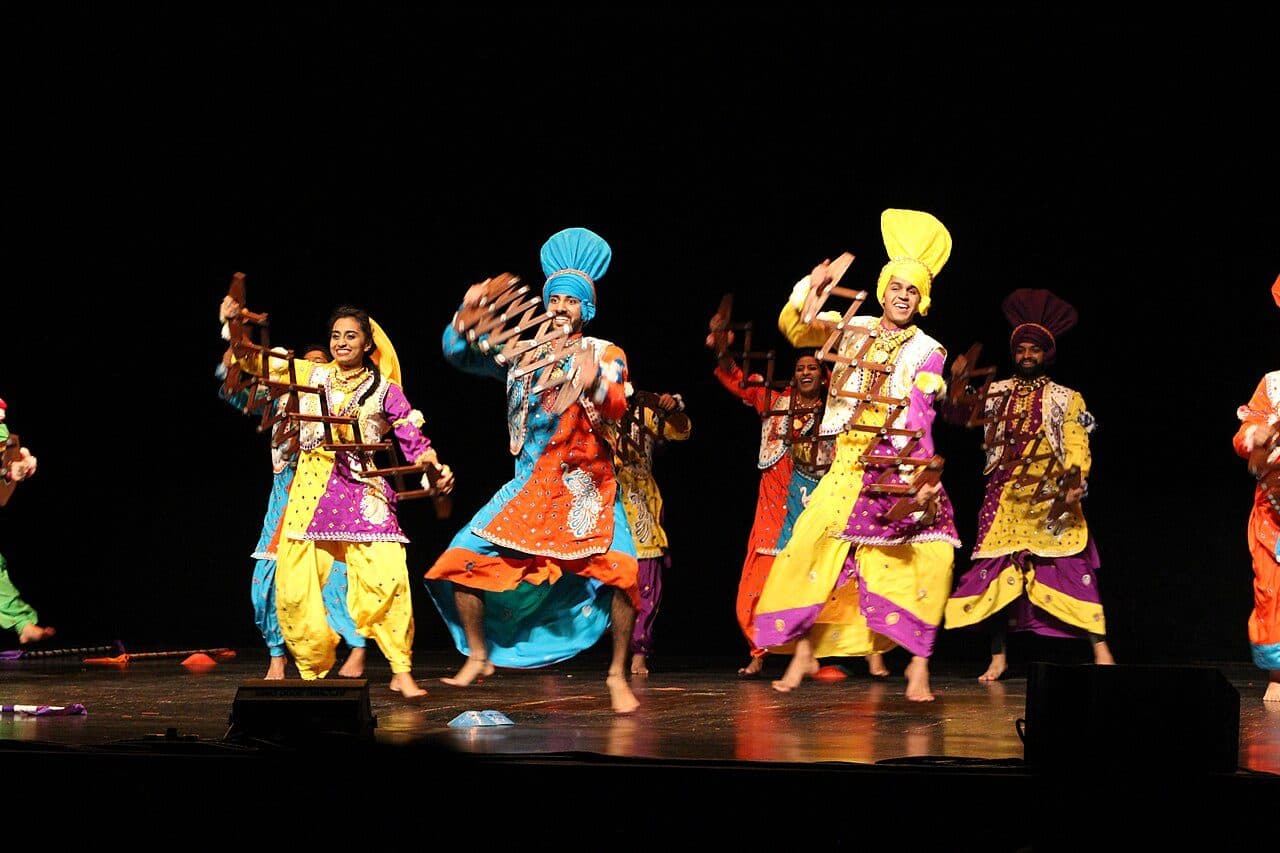 Bhangra ensemble in performance costume
