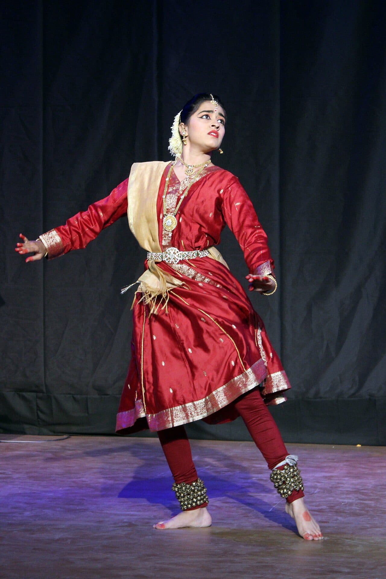 Kathak dancer in a classical pose with ghungroo